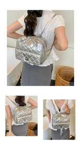 Detail of silver metallic quilted backpack with star ornament and metal twist lock closure