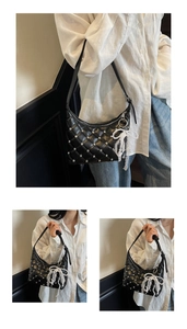 Detail of black quilted crescent bag with sparkling rhinestones and white lace bow charm