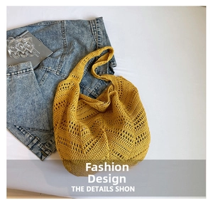 Detailed close-up of yellow hollow crochet pattern on bohemian summer tote bag