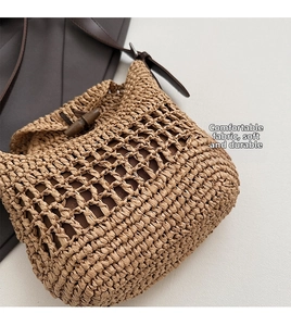 Detail of woven straw shoulder bag with leather strap and vintage horn buckle closure
