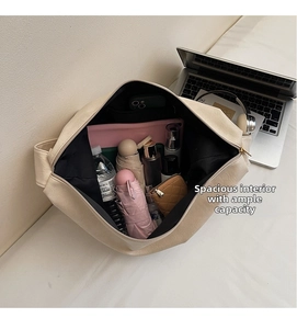 Top view of spacious cream-white tote bag interior showing daily essentials storage