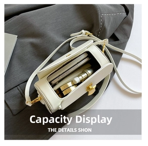 Interior storage capacity of the cream crossbody bag showing phone and cosmetics