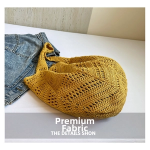 Detailed close-up showing the yellow hollow crochet weave and texture of the shoulder bag