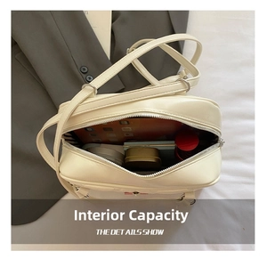 Quilted cream crossbody bag interior showing spacious capacity for tablets and cosmetics