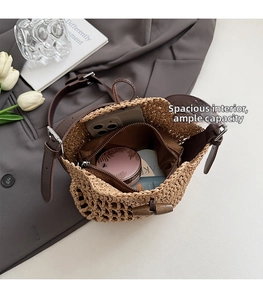 Top view of woven straw bucket bag showing spacious interior with fabric lining and pocket