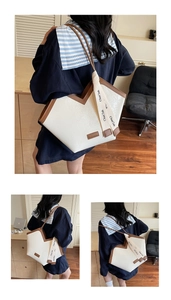 Detail of vintage tote bag with white cracked leather and brown contrast shoulder strap