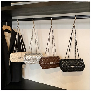 Detailed comparison of quilted crossbody bags in white, silver, brown, and black colors
