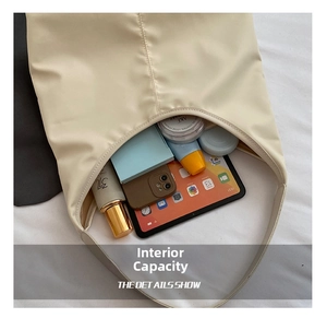 Top view of large capacity beige tote bag showing spacious interior with daily essentials