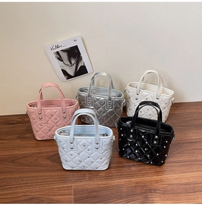 Detailed display of five colorful quilted bucket bags with stylish metal stud decorations