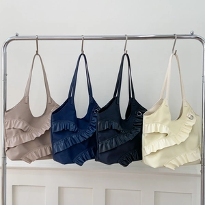 Large nylon tote bags for women in four colors featuring tiered ruffle design details