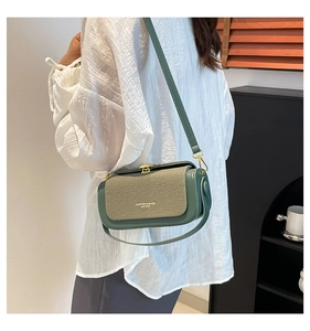 Detail of vintage square bag in dark green and beige with gold metal buckle