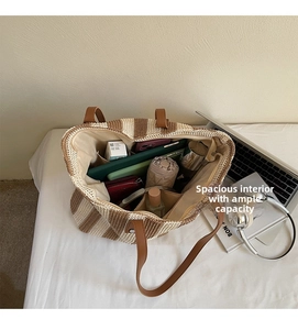 Interior view of large capacity striped straw tote bag showing spacious storage space