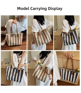 Close-up showing the spacious interior and striped straw texture of the large tote bag