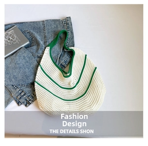 Detailed top view of handmade cream woven bag with green curved stripes and matching handles