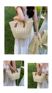 Detailed view of handmade woven straw tote with leather straps and hollow texture pattern