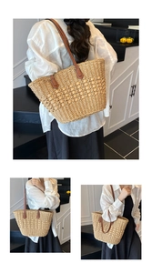 Detailed view of woven straw tote bag with contrast brown leather shoulder straps