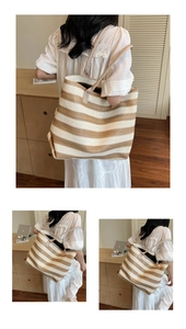 Close-up of the beige and white striped woven tote bag with durable reinforced straps