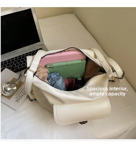 Top view of cream large leather tote bag showing spacious interior with daily essentials