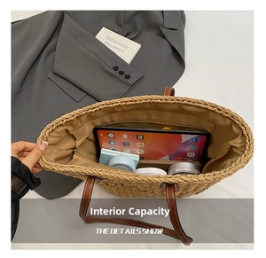 Interior view of straw tote bag showing spacious capacity for tablets and cosmetics