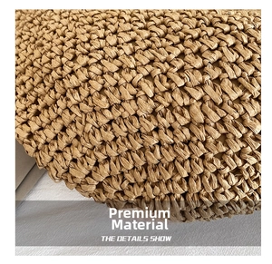 Macro detail of high-quality handcrafted tan woven texture on this stylish beach straw bag