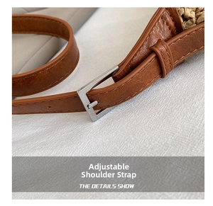 Close-up of adjustable brown leather shoulder strap with silver buckle on straw bag