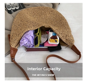 Detail view of straw shoulder bag internal capacity with essentials and zip closure