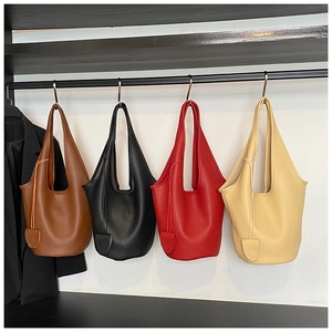 Close-up of four lychee pattern leather bucket bags in brown, black, red, and beige colors