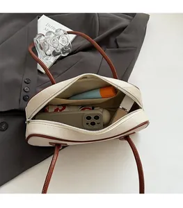 Top view of cream canvas tote bag interior showing spacious storage and inner pocket