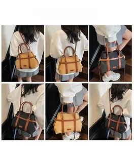 Vues détaillées du sac cabas en toile et cuir montrant les styles porté main et bandoulière