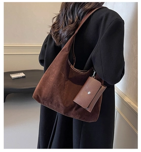 Detail of dark brown matte suede hobo tote bag with a small detachable pouch