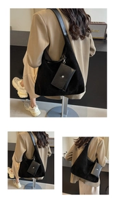 Detail of minimalist black matte suede hobo tote bag with a detachable coin purse