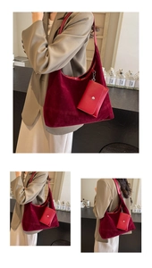 Detailed view of burgundy velvet crescent tote with matching small pouch and soft texture