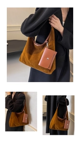 Detail of warm brown suede hobo tote bag featuring a detachable small zipper pouch