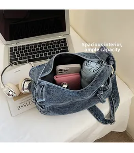 Spacious blue denim tote bag interior showing capacity for phone, wallet and umbrella