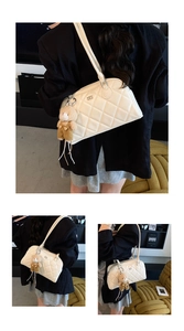 Detailed views of white quilted bowling bag with cute brown teddy bear charm pendant