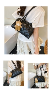 Close-up of quilted black bowling bag with a metal logo and a cute teddy bear charm
