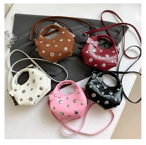 Detailed collection of studded crescent handbags in five colors with bow knot accents