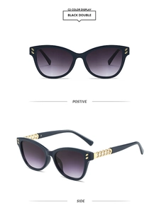 Detail of square cat-eye sunglasses with purple gradient lenses and gold chain temples