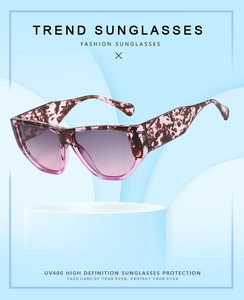 Detail of square frame sunglasses with purple marble texture and gradient lenses