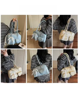 Detail shots of shoulder bag featuring heart pocket, lace bow and pearl pendant decor