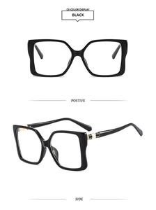 Detailed views of black oversized square sunglasses with stylish metal hinge accents