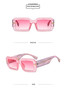 Detail view of pink square sunglasses with marble pattern temples and gradient lenses