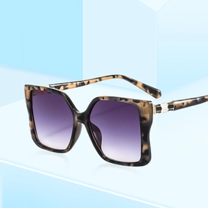 Chic oversized square tortoiseshell sunglasses with gradient purple lenses and metal snake motif