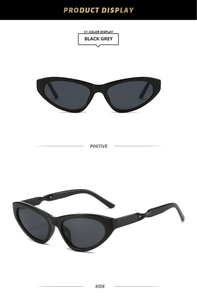 Detail view of black cat-eye sunglasses with unique spiral twisted temple design