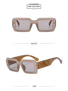 Macro view of gray square sunglasses featuring thick frames and amber textured temples