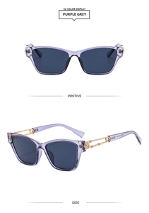 Detail view of purple grey square sunglasses with golden spiral metal temple design