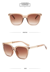 Detail of champagne square sunglasses featuring elegant pearl trim on the side temples