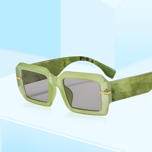 Chic light green marble pattern square frame sunglasses with gold temple accents on blue block