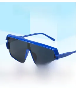 Detail of square oversized shield sunglasses in blue frame with dark grey wide lenses