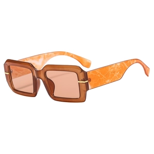 Fashionable square amber sunglasses with marble textured temples and gold metal accents